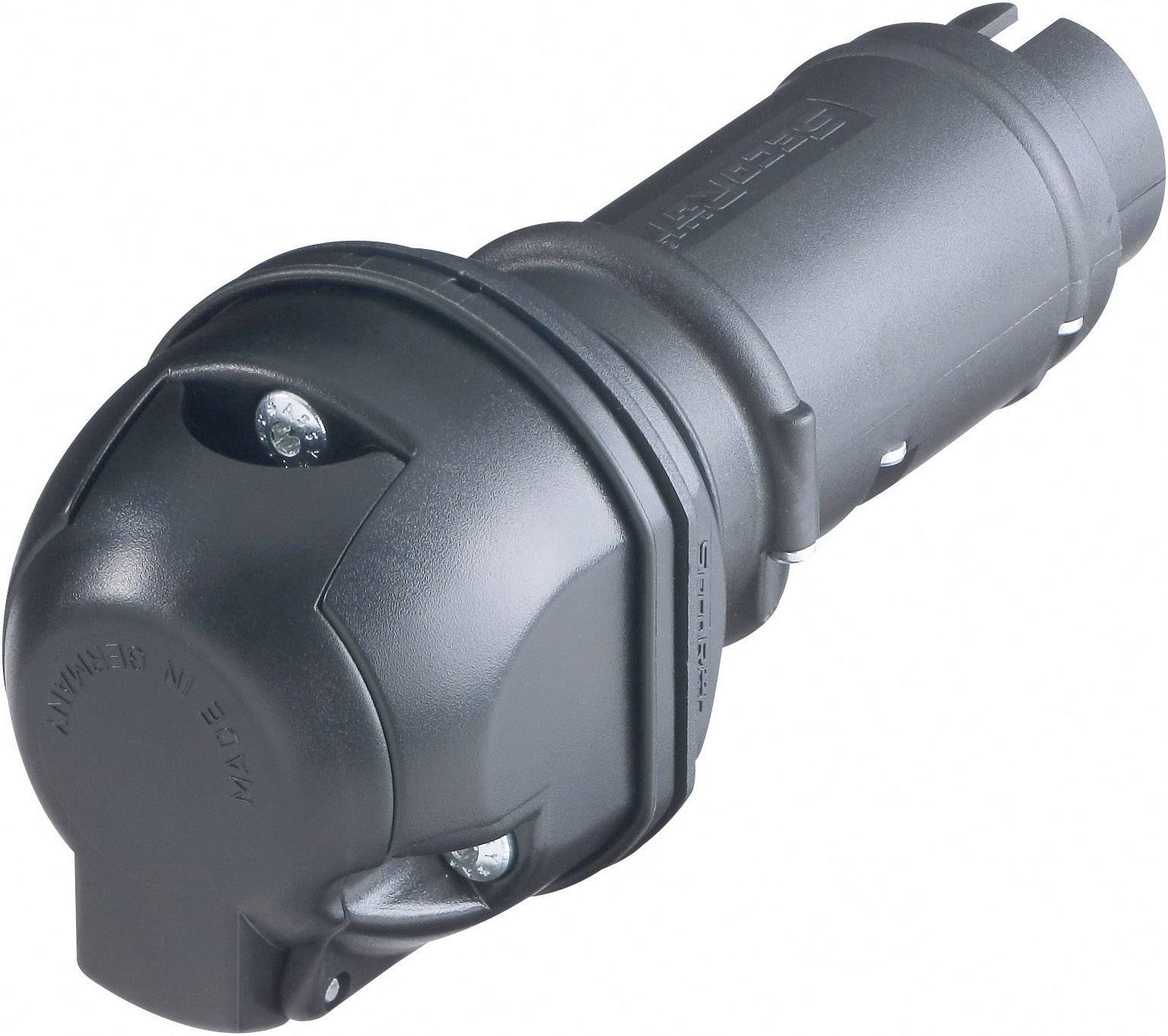 Black round socket adapter with three screws for connecting electrical devices, on a light background.