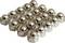 Metallic safety screws with spherical caps, uniformly aligned, reflect light and demonstrate industrial applications.