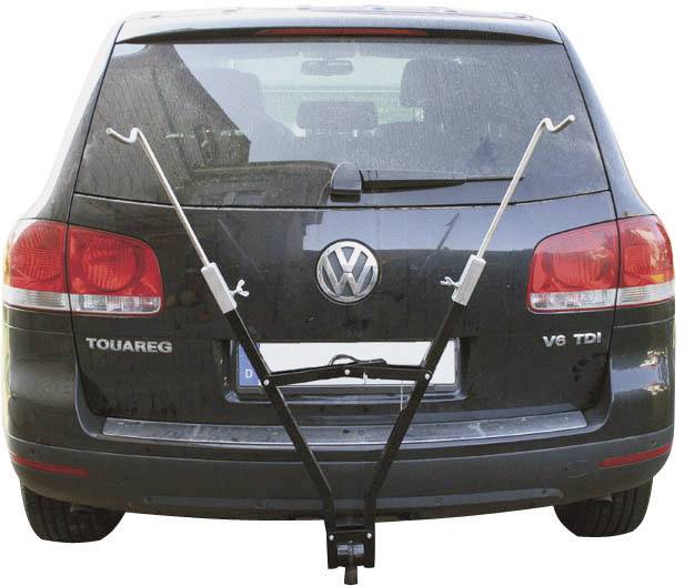 The image shows the rear of a black car with a bicycle roof rack attached to the boot.