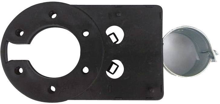 A black, rectangular plastic component with multiple holes and a round, metallic cut-out on the right side.