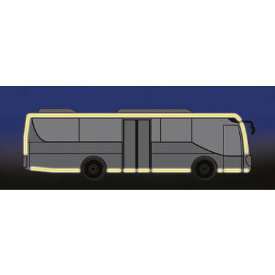 A grey bus with a yellow border on a dark background. The bus has two doors and no visible passengers.