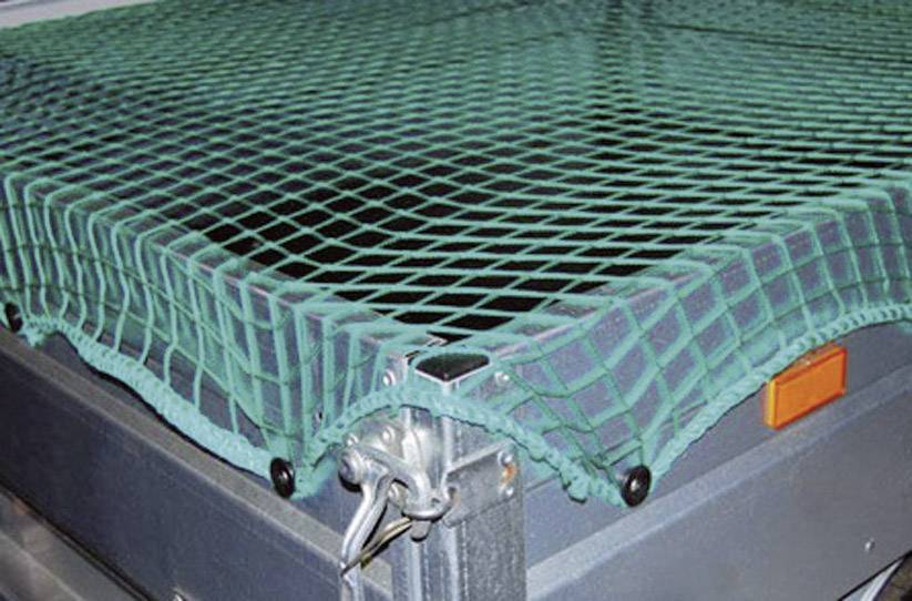 A green safety net is stretched over a metal container. The net is secured for the safe transportation of items.