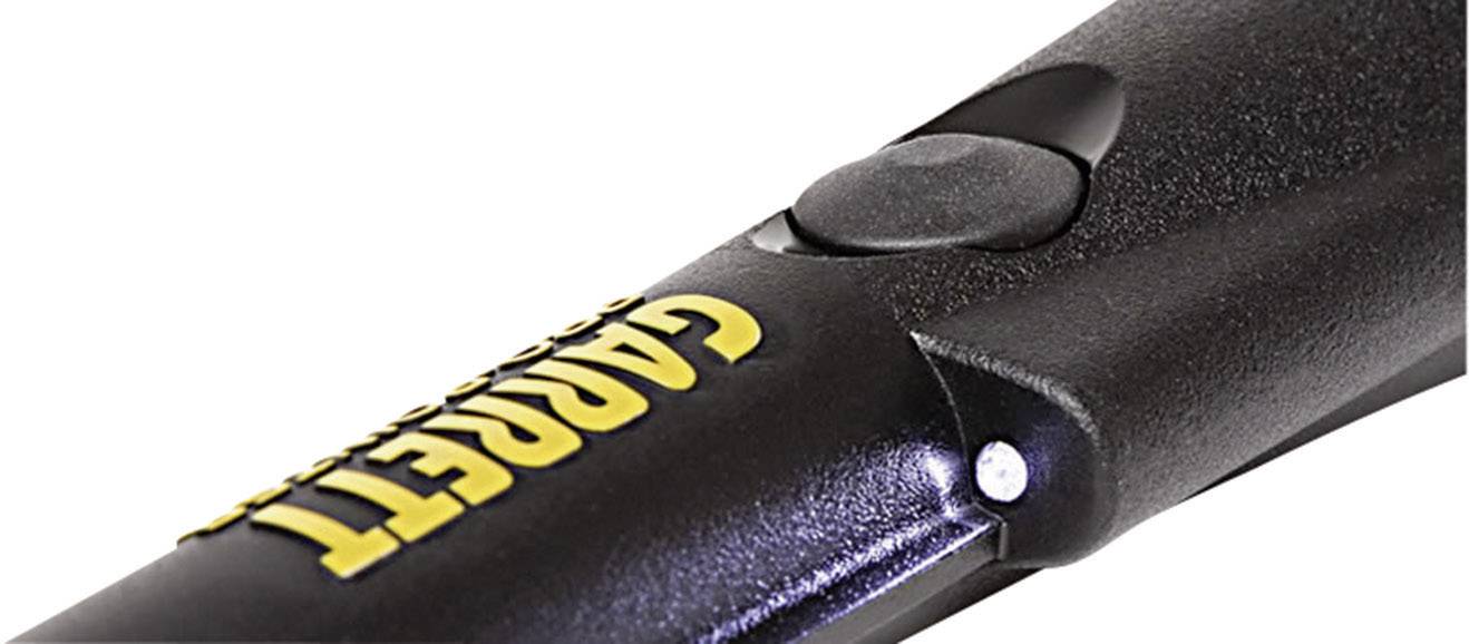Handheld metal detector, black with yellow lettering.