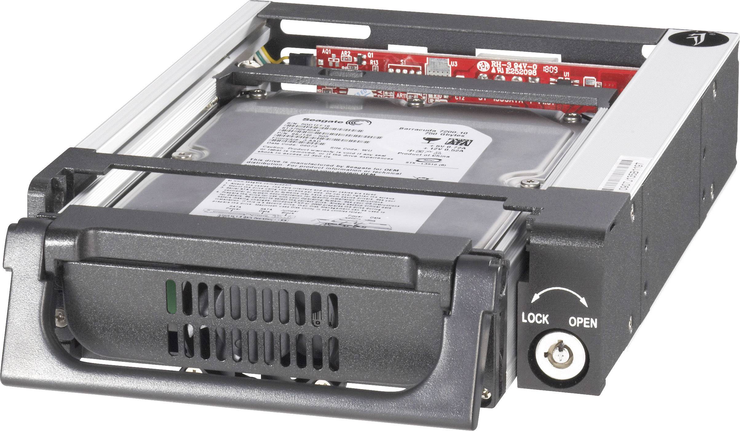 A hard drive is located in a removable hard drive caddy with a lock. The caddy is partially open.