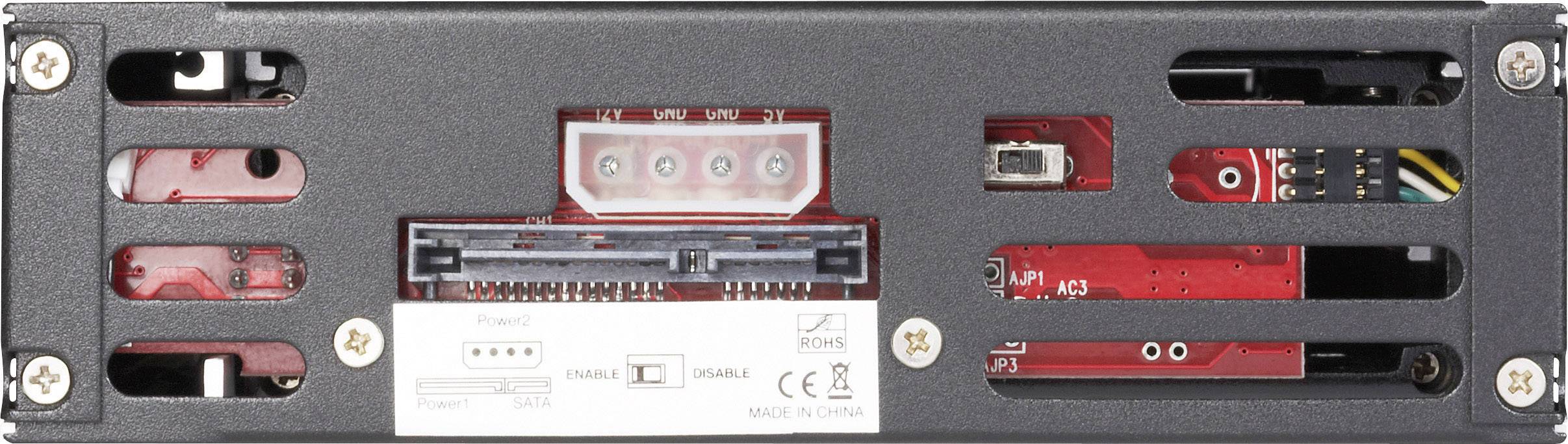 Back of a technical device with various ports and screws. Ventilation openings are visible.