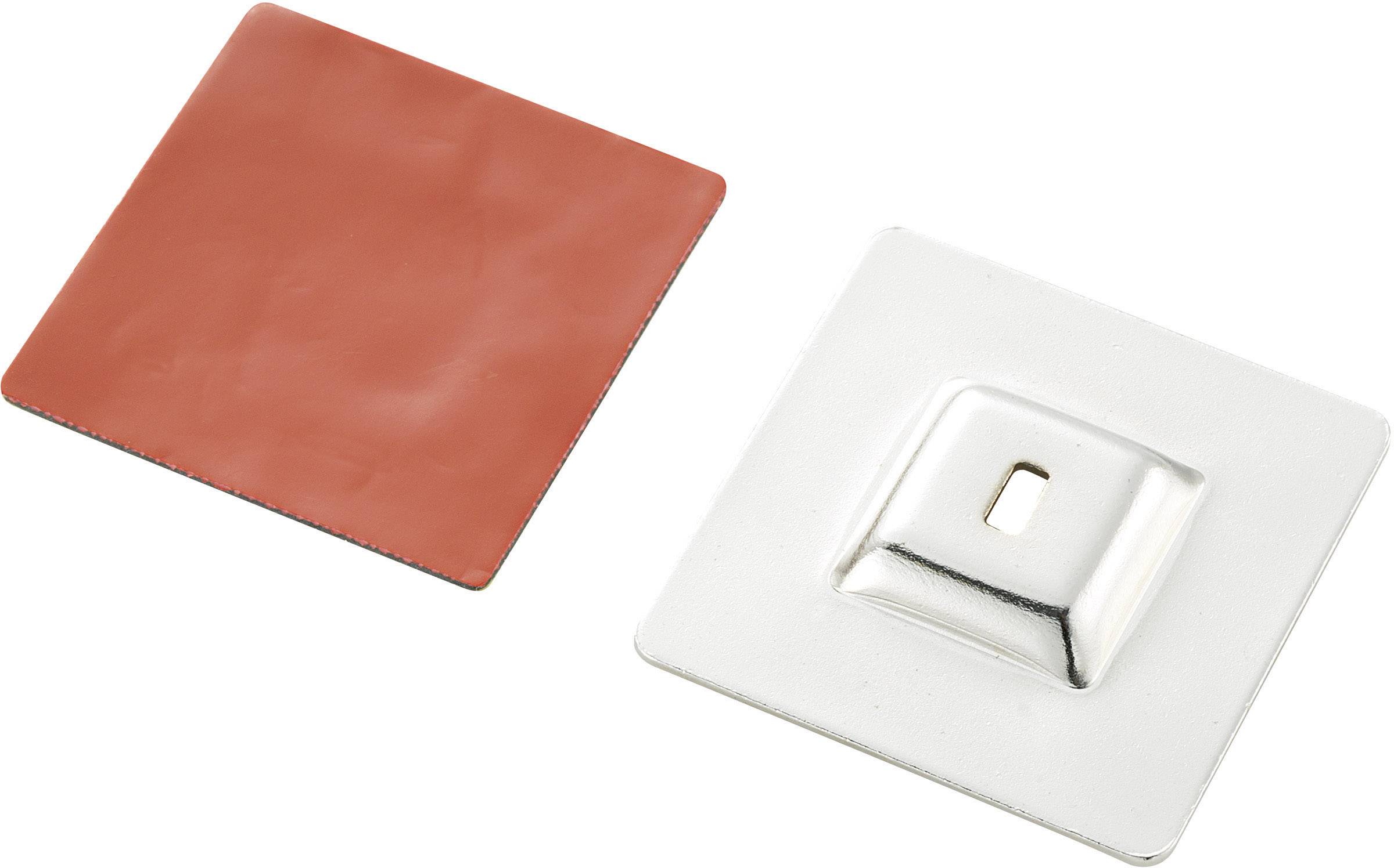 Two square metal plates, one red and one silver, with the silver plate's edge slightly raised.