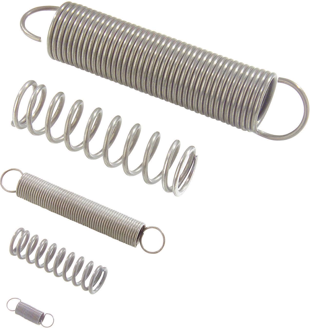 Various metal springs of different sizes and shapes, layered on top of each other.