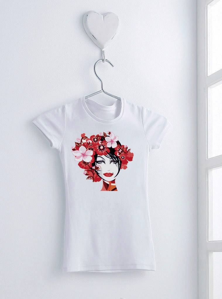 A white T-shirt hangs on a coat hook with a heart motif. A portrait of a woman with flowers in her hair is printed on the T-shirt.