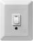 'A simple light switch on a white plate, switched on in the upper position.'