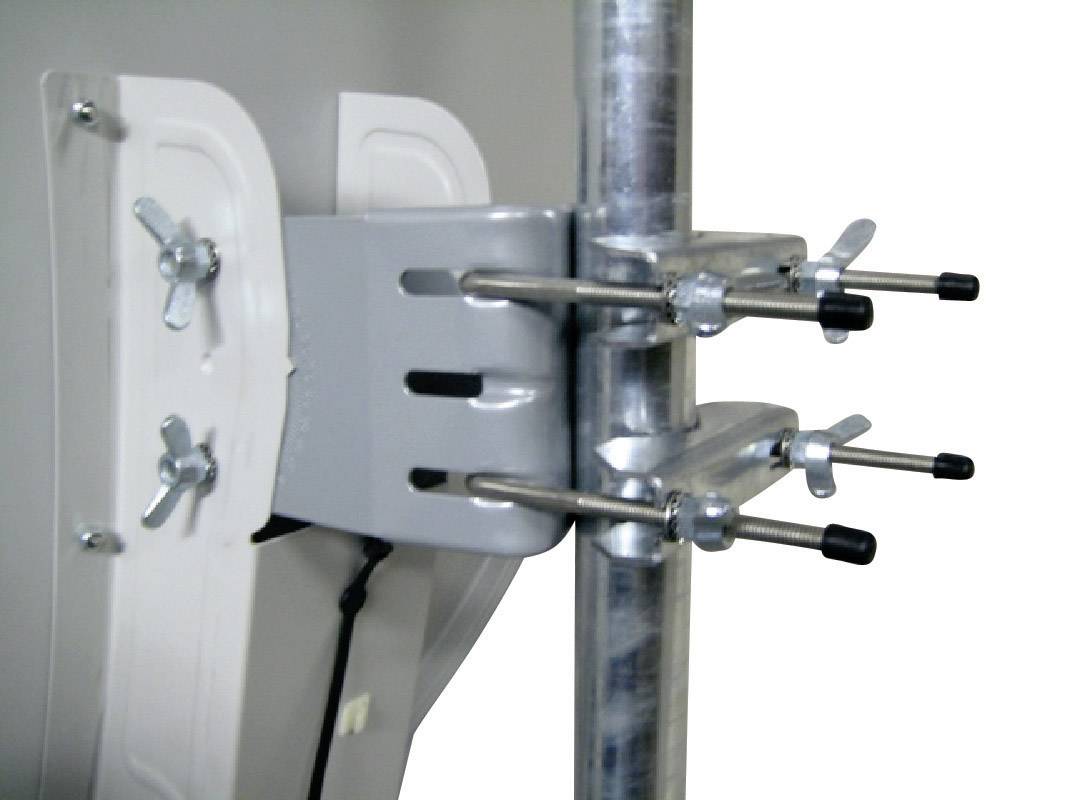 A mounting bracket with screws and clamps secures a metal plate to a pipe.