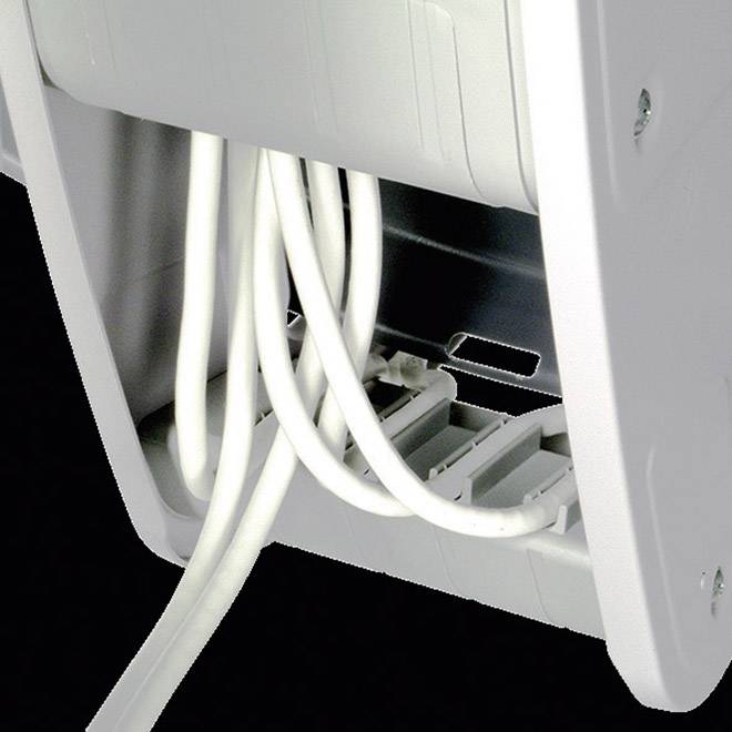 A cable management system with multiple cables neatly guided through a holder. It keeps the workspace organised.