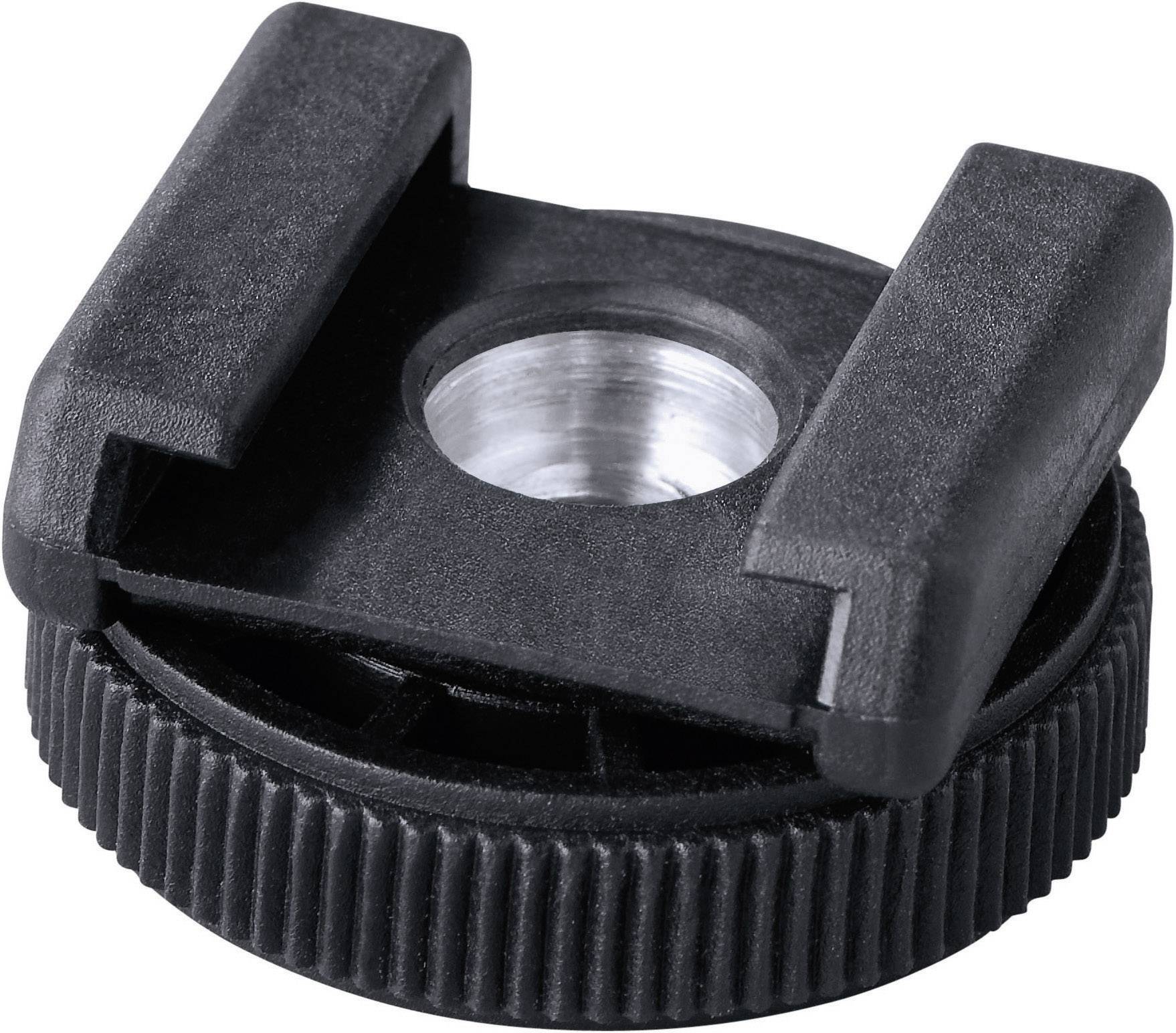 A black camera accessory adapter with a circular toothed edge and two side mountings, with a metal opening in the centre.