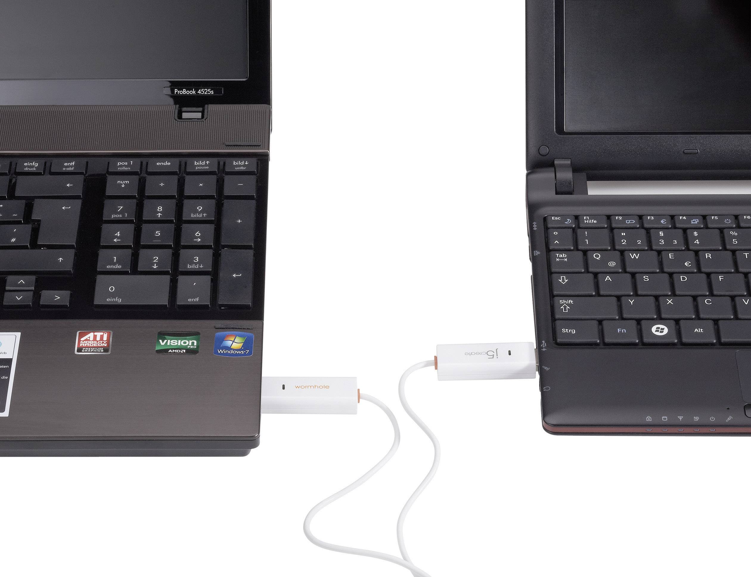 Two laptops connected by a USB cable; left laptop - black with Windows stickers, right laptop - black-grey.