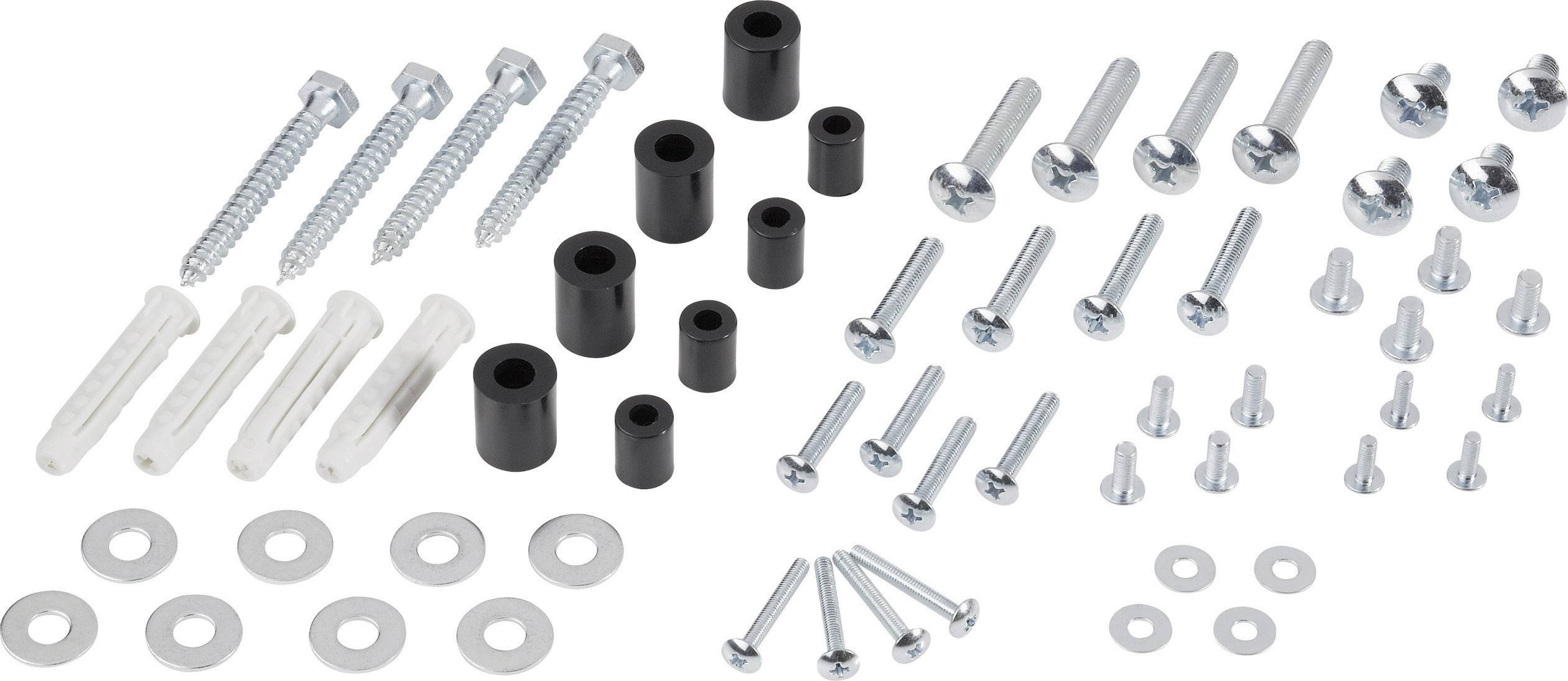 Various screws, wall plugs and washers, arranged on a white surface.