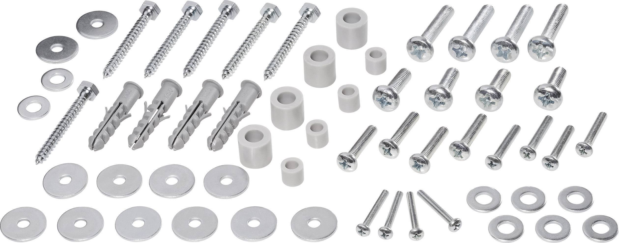 Various screws, wall plugs and washers in different sizes and shapes, arranged on a white surface.