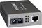 Grey-black TP-Link media converter with fibre and Ethernet ports on the left, right Ethernet port with speed indicator.