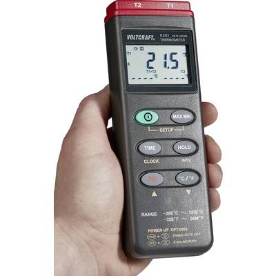 Un thermomètre manuel avec affichage numérique, indiquant 21,5 degrés Celsius. L'appareil dispose de touches pour différentes fonctions et plages de température.