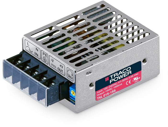 Un bloc d'alimentation rectangulaire de Traco Power avec des fentes de ventilation et des connexions électriques. Modèle TXL 015-15S, entrée 100-240VAC, 0,45A.