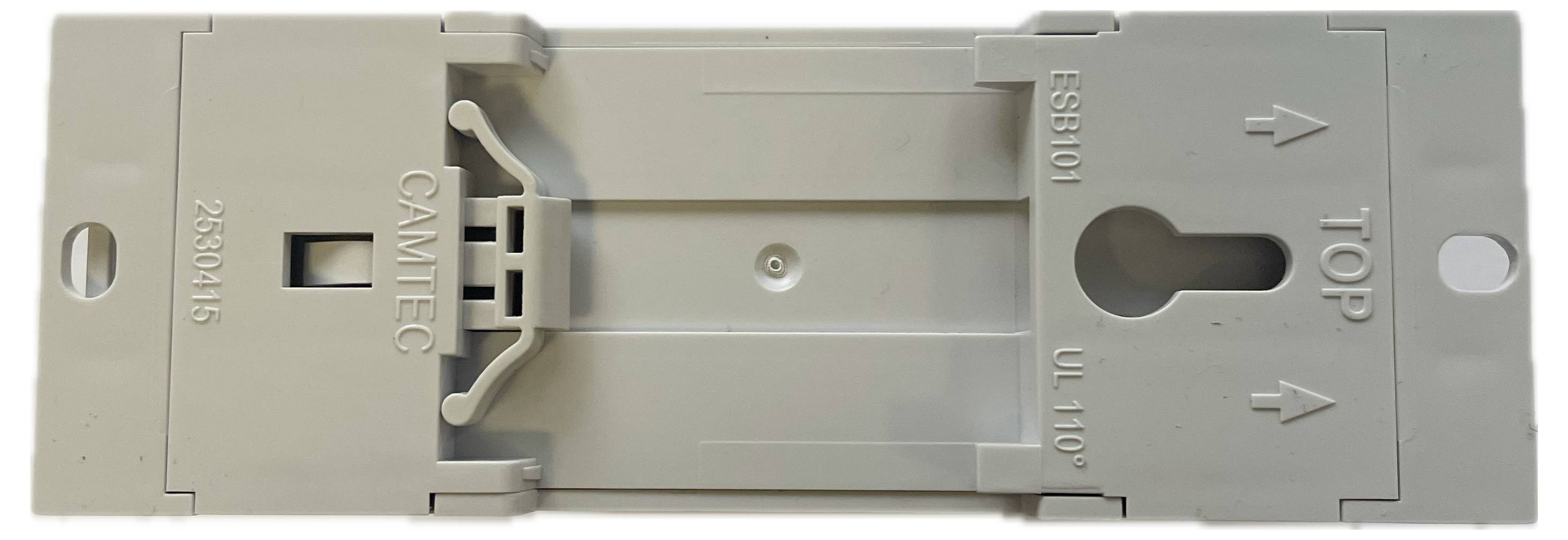 Support en plastique de forme rectangulaire portant les inscriptions 'TOP', 'GAMTEC', 'UL 110', 'ES101', et '2330145'. Comprend un trou de fixation central.