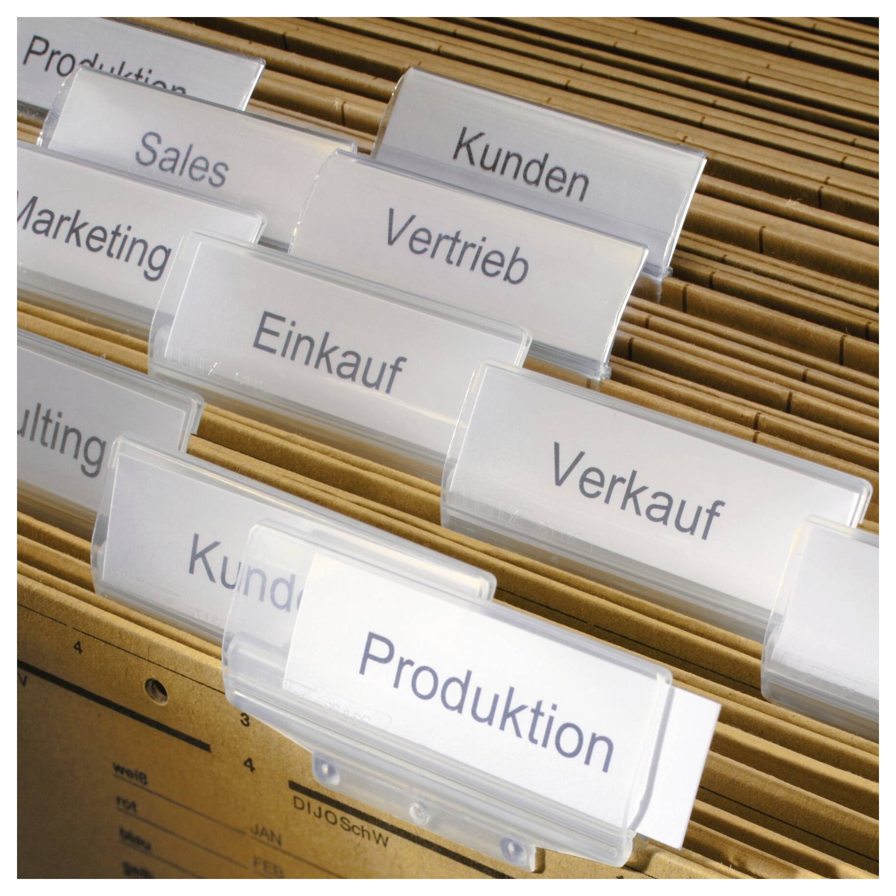 Dossiers avec des onglets étiquetés en français, notamment "Clients", "Ventes", "Achats", "Ventes" et "Production", organisés dans un classeur.