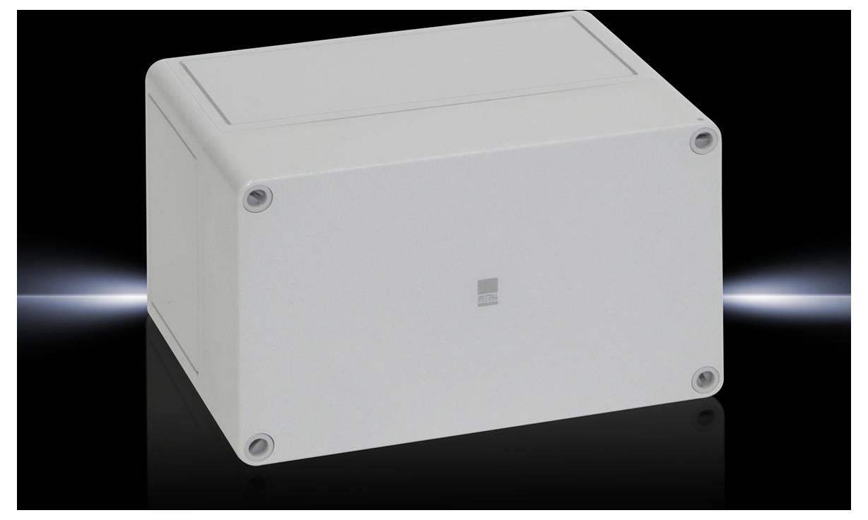 Boîtier en plastique gris sur fond noir. Forme rectangulaire avec des coins arrondis et quatre vis visibles aux angles.