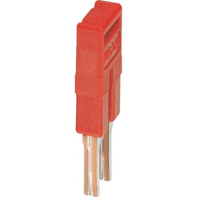 Un capuchon de pontage électronique rouge avec deux broches métalliques, utilisé pour établir des connexions sur les cartes de circuits imprimés.