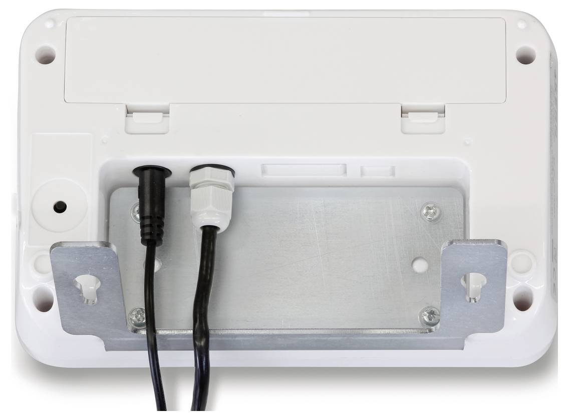 Arrière d'un appareil technique avec deux câbles connectés passant par différentes ouvertures. Des supports de fixation sont visibles.