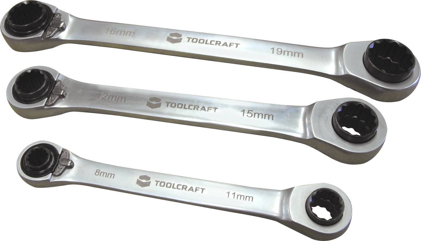 Trois clés à cliquet réversibles en argent de Toolcraft avec indications de tailles : 16/19 mm, 12/15 mm, 8/11 mm.