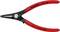 Pince à circlips rouge KNIPEX, adaptée pour des anneaux de 3-10 mm, poignées arrondies latéralement, étiquette 'Made in Germany'.