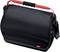 Sac à outils noir avec poignée rouge et bandoulière. Conçu pour le transport sécurisé des outils.