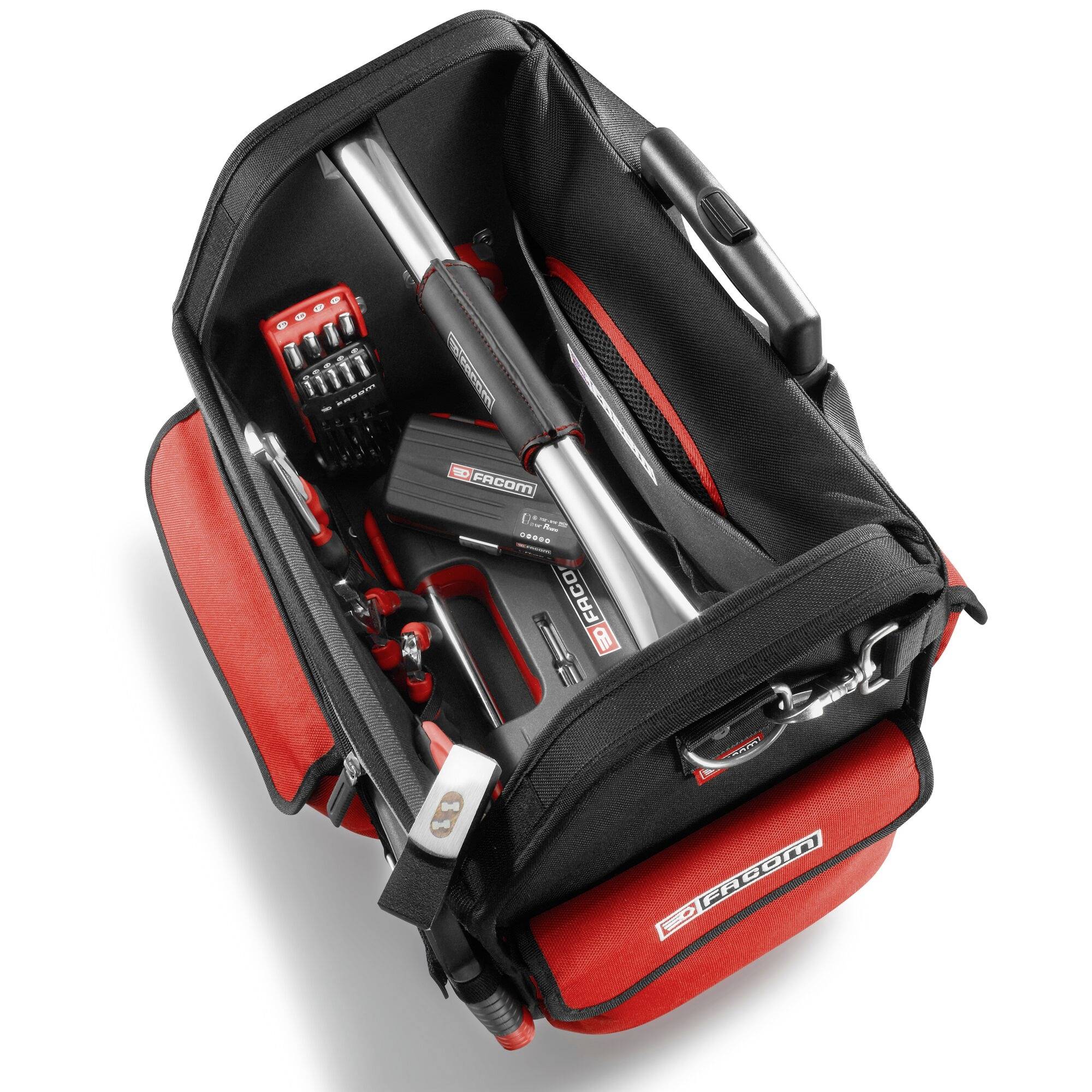 Un sac à outils ouvert contenant divers instruments tels qu'une pince à tube, un jeu de tournevis et une visseuse sans fil, tous disposés dans un intérieur douillet et rembourré avec des touches de rouge.