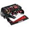 Sac à outils noir ouvert contenant des outils rouges et noirs, ainsi qu'un ordinateur portable, destinés à la maintenance ou à la réparation.