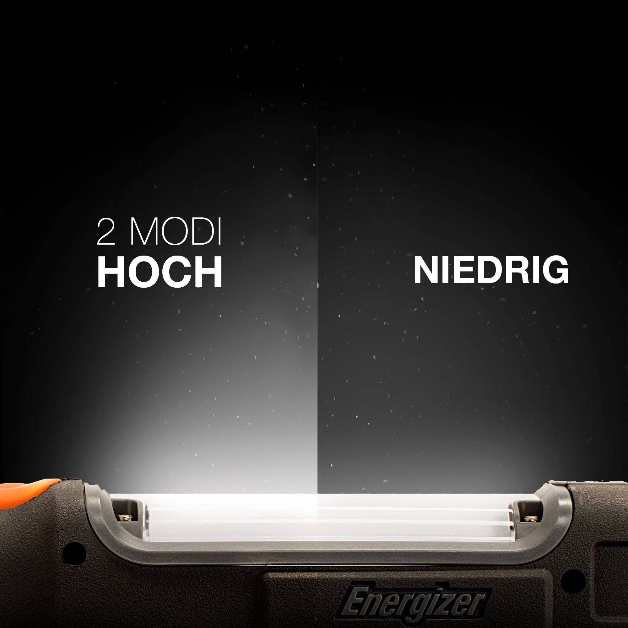 Lampe de poche à deux modes : Haut et Bas. Sur l'image, les deux modes s'illuminent avec une intensité différente sur une surface sombre.