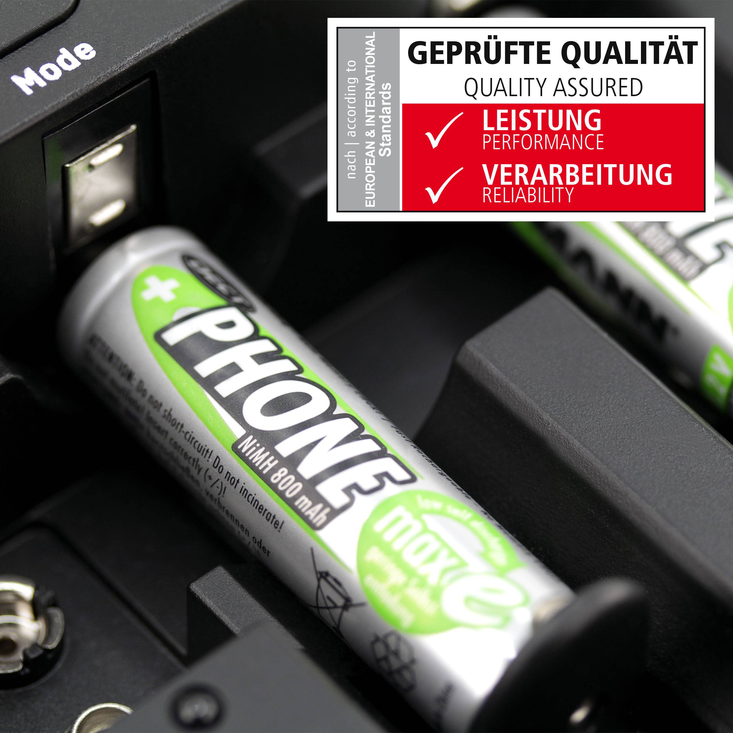 Une pile AA de la marque 'PHONE' de 800 mAh sur un chargeur. Une étiquette en haut à droite indique 'QUALITÉ CONTRÔLÉE' avec un accent mis sur les performances et la fabrication.