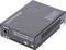 Convertisseur multimédia compact noir portant l'inscription « Cet appareil est conforme à la Partie 15 des règles de la FCC », avec connexion d'alimentation CC et logos.