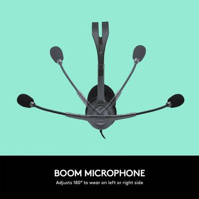 Un casque avec quatre bras de microphone et des écouteurs en noir. Vue de dessus, fond neutre.