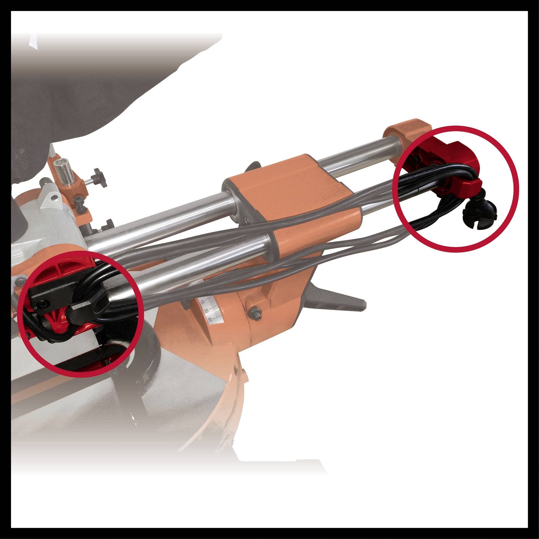 Une machine avec deux barres métalliques mises en évidence par des anneaux rouges. Des connexions et des fixations sont représentées.