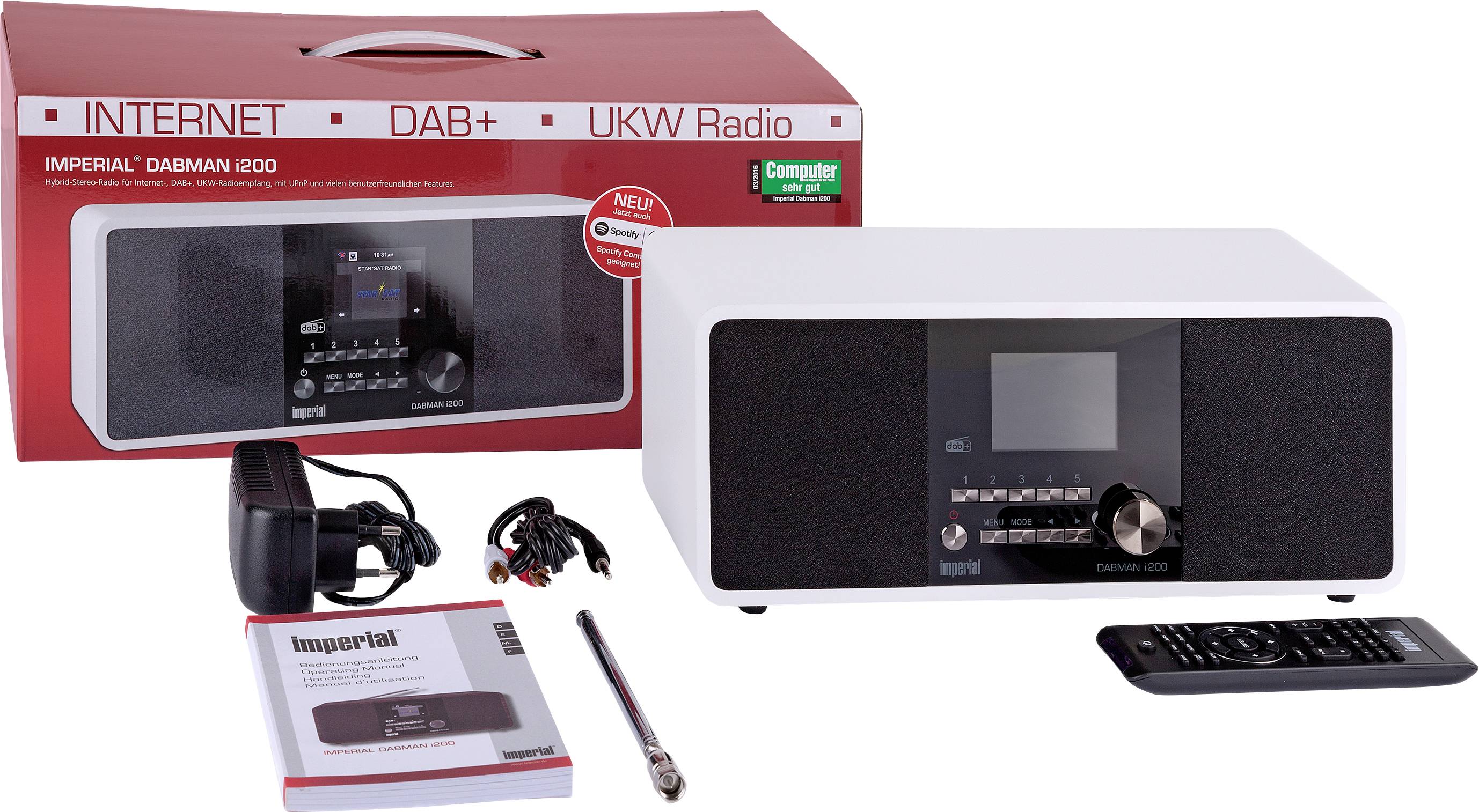 Radio Imperial Dabman i200 blanc avec accessoires, comprenant la télécommande, l'adaptateur secteur, l'antenne et le mode d'emploi. Emballage en arrière-plan.