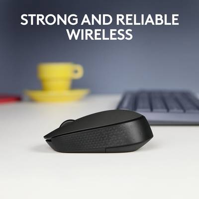 Souris noire sans fil sur une table, tasse jaune et clavier en arrière-plan. Texte en haut : 'Connexion sans fil stable et fiable'.