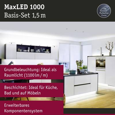 Voici la traduction en français :<br><br>'Ensemble de base MaxLED 1000 1,5 m' Publicité. Cuisine avec éclairage LED, information produit : '1100 lm/m', idéal pour la cuisine, la salle de bain et les meubles.
