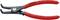 Une pince à circlips Knipex, rouge, conçue pour des circlips de 19-60 mm, avec des embouts noirs et une articulation latérale, fabriquée en Allemagne.
