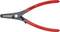 Une pince à circlips rouge avec tête noire, adaptée pour des circlips de 40-100 mm. Marquage : 'Knipex', 'Made in Germany'.
