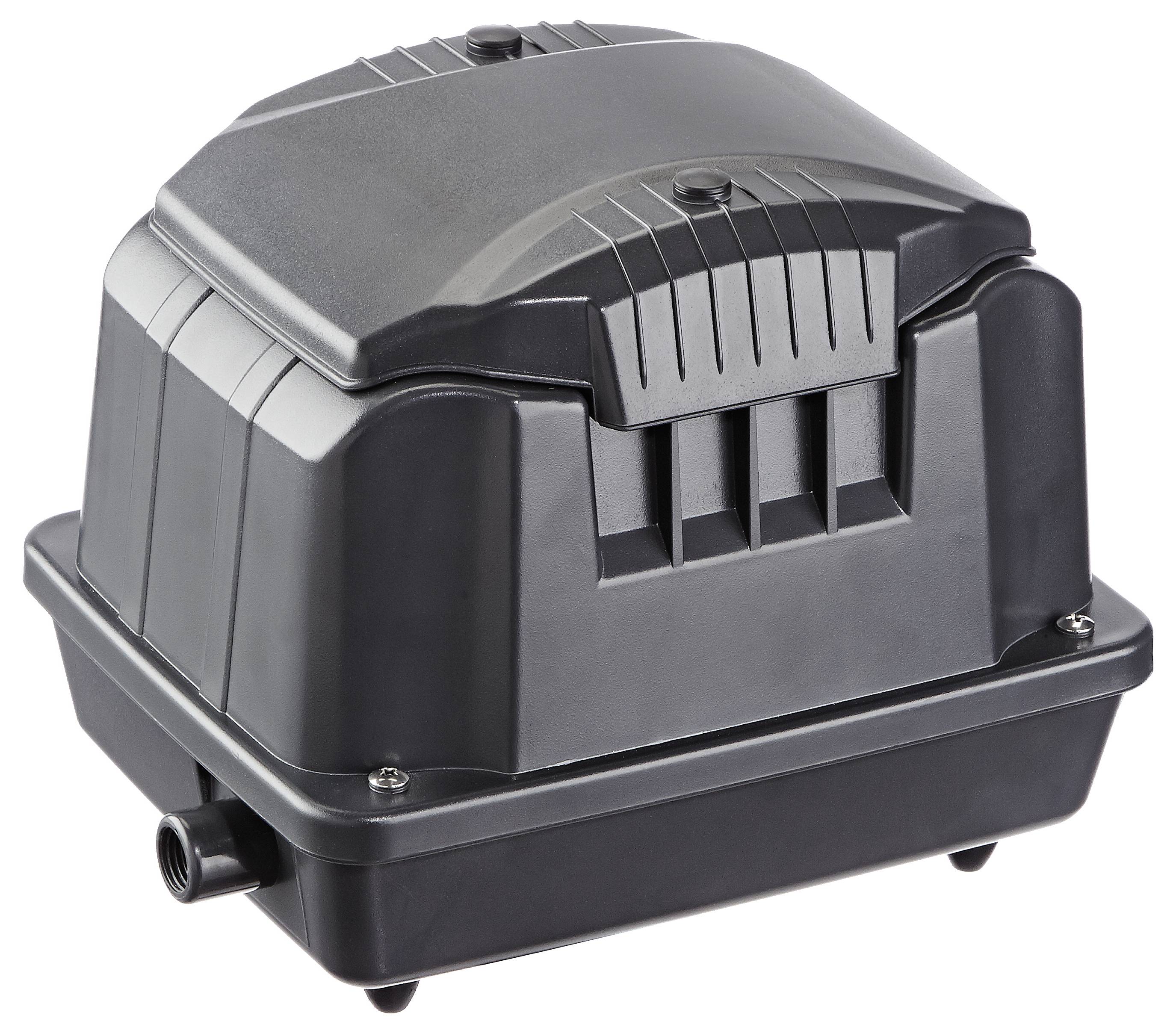 Un dispositif noir de forme rectangulaire avec un sommet strié et un connecteur à la base, généralement utilisé comme pompe à air ou compresseur dans divers systèmes.