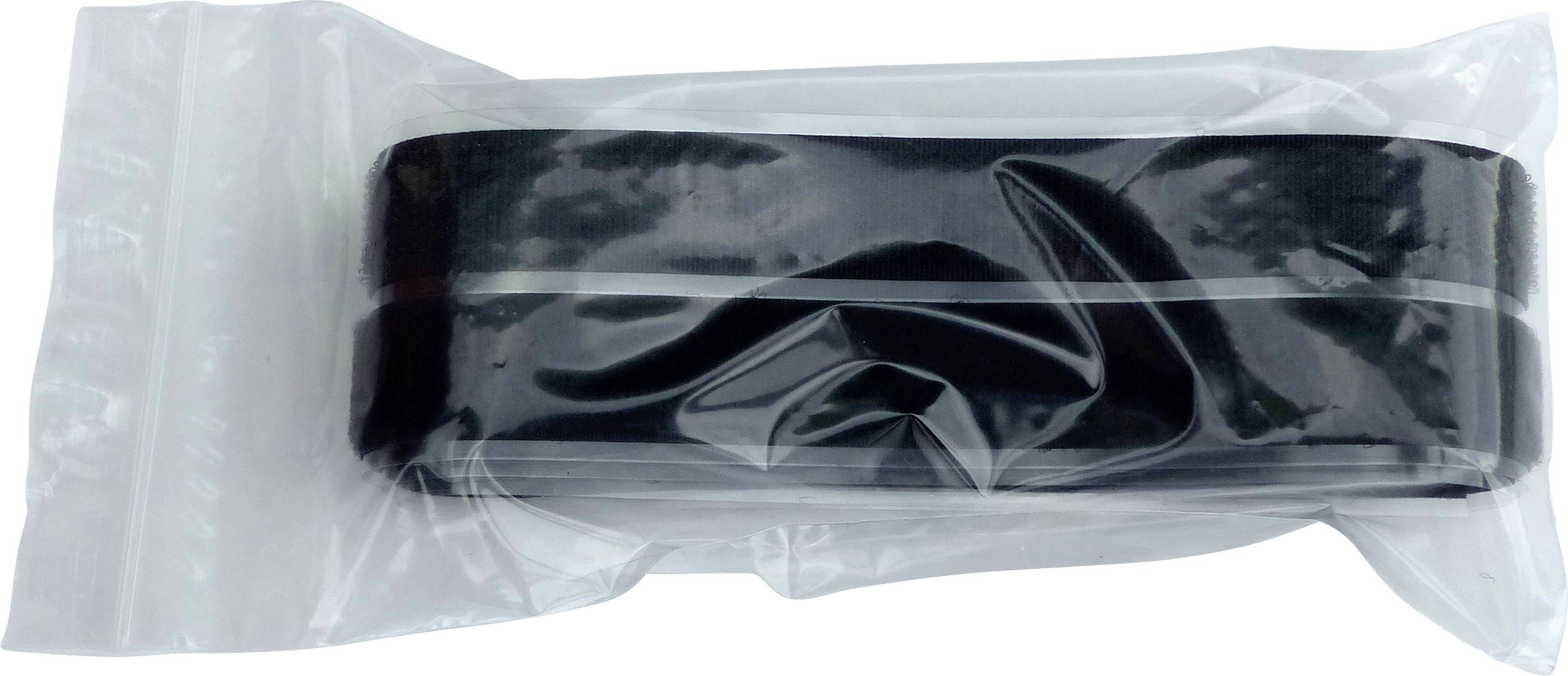 Ruban noir dans un sac en plastique transparent, posé à plat.