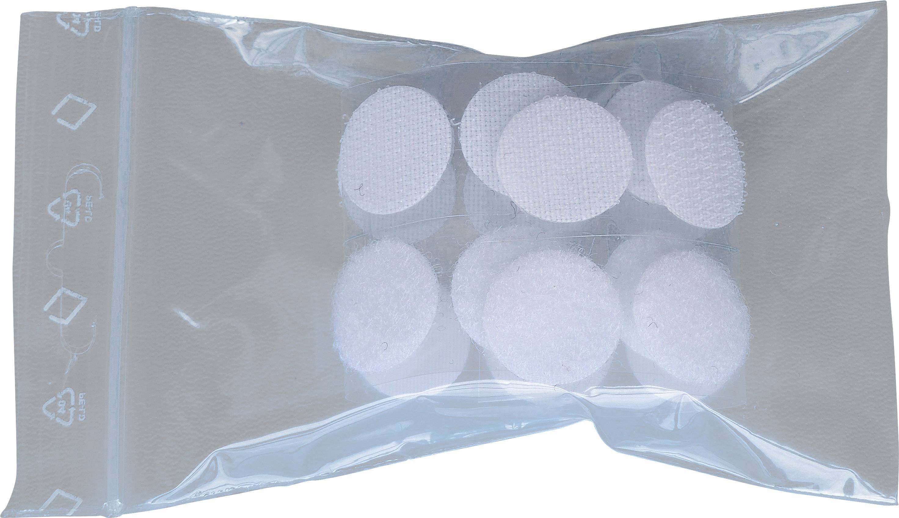 Points de fermeture adhésifs dans un sac en plastique transparent. Sept points velcro blancs et ronds sont visibles.