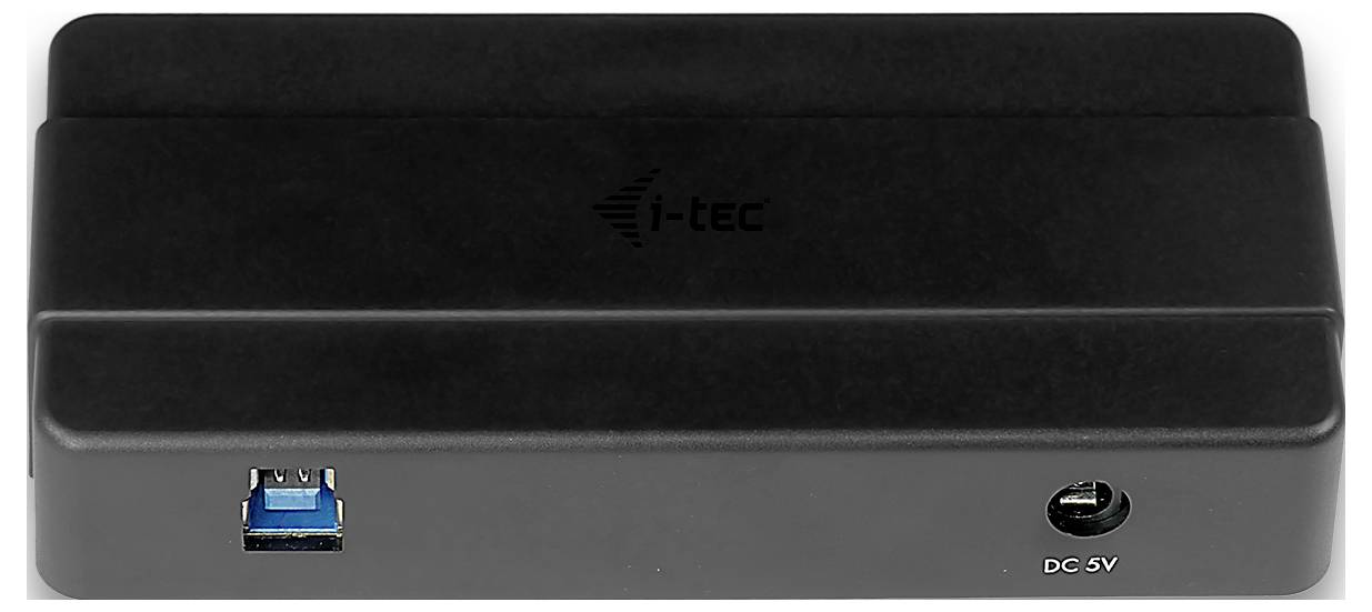 Une station d'accueil i-tec noire avec un port USB sur la gauche et une entrée d'alimentation CC 5V sur la droite, vue de face.