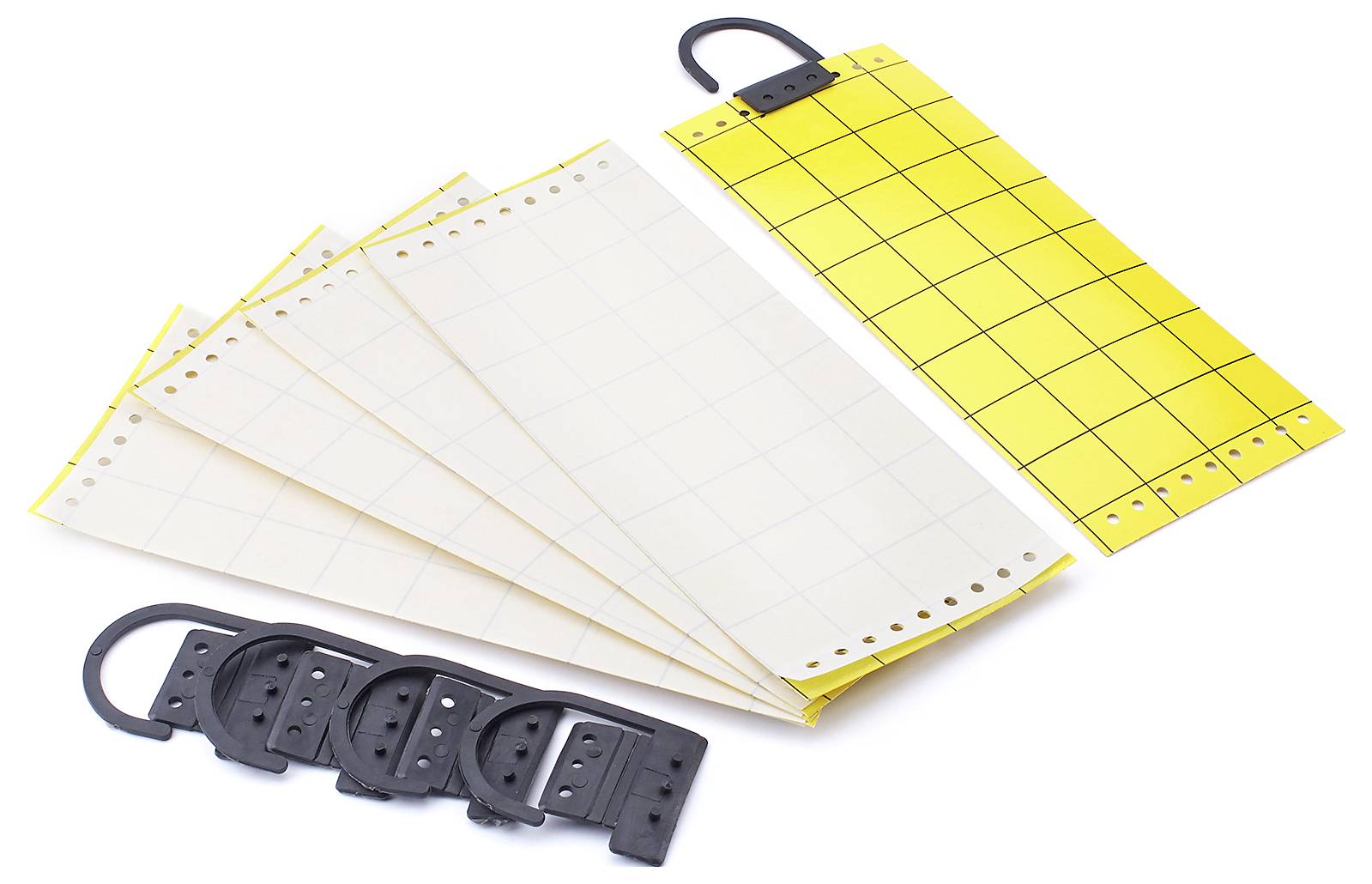 Système de reliure 'Key-Kanal' avec feuille jaune et formulaires perforés pour la reliure, associé à des peignes en plastique noir pour sécuriser les documents.