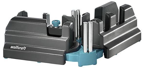 Support à outils gris-bleu doté de différentes fentes et broches pour la fixation des pièces d'outillage, adapté aux travaux artisanaux.