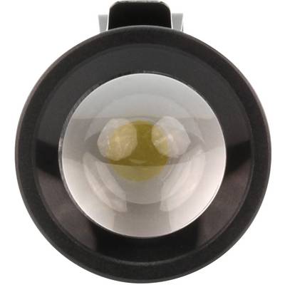 Gros plan sur un objectif rond en verre avec un bord noir, suggérant un grossissement ou une mise au point optique.