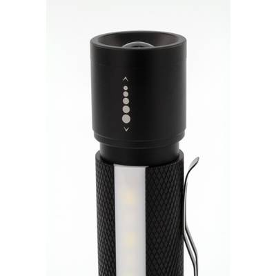 Lampe de poche avec boîtier noir et clip, affichant des symboles de niveaux de luminosité sur la tête, avec une bande LED illuminée en dessous.